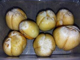 Snake fruit Salacca zalacca in a lunch box photo