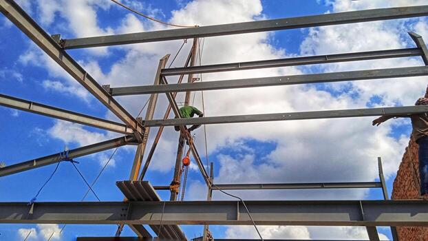 Structure of steel for building construction on sky background. photo