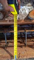 Measuring tape tool on a construction site. photo