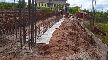 Foundation site of new building - construction industry details, cement and concrete building photo