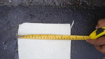 Measuring tape tool on a construction site. photo