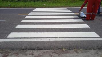 Crosswalk signs on the road photo