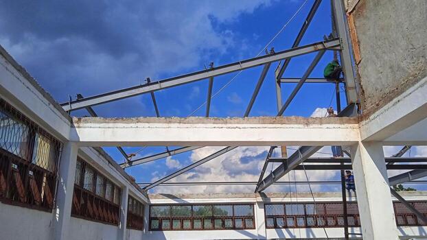 Structure of steel for building construction on sky background. photo