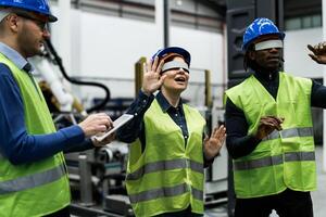 Team of engineers having simulation experience with futuristic virtual reality glasses inside robotic factory - Tech industry and metaverse concept photo