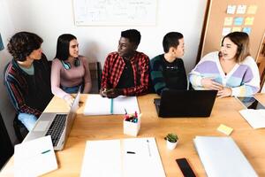 Young multiracial people studying in classroom - School education concept photo