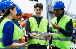 Team of engineers working in robotic factory - Tech industry concept photo