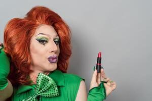 Happy drag queen portrait doing makeup photo