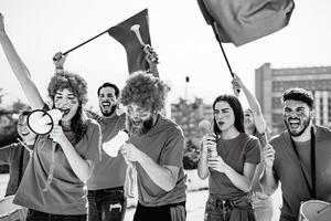 Young people football fans supporting favorite club - Sport entertainment concept photo