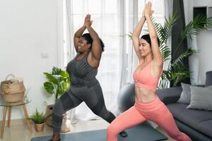 Young Latin women doing yoga and pilates at home - Sport wellness lifestyle concept photo