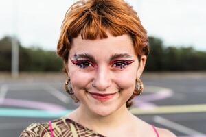 Happy young girl smiling in front of camera outdoor photo