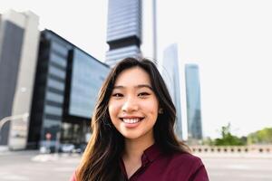 Happy Asian business woman outside enterprise office photo