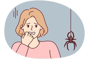 Frightened woman puts hand to face sees large spider descending from ceiling along web. Vector image