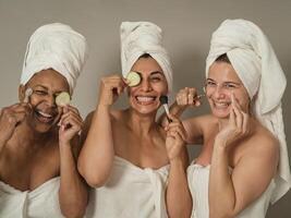 Happy females having skin care spa day - People wellness and selfcare concept photo