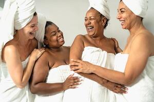 Happy females with different age and body size having skin care spa day - People wellness and selfcare concept photo