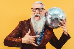 Senior party man celebrating new year's eve in disco club photo