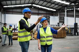 Team of engineers working in robotic factory - Automation industry concept photo