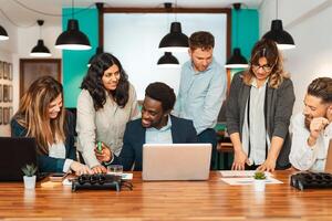 Business team of diverse people working together inside modern office - Entrepreneurship concept photo