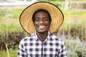 Happy African farmer working in farmhouse country - Farm people lifestyle concept photo