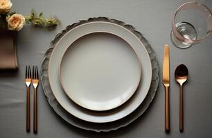 AI generated an empty dinner plate, silverware, and candle stand on grey table photo