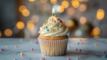 AI generated A birthday cupcake with a candle placed on a light grey table, set against a background of blurred lights photo