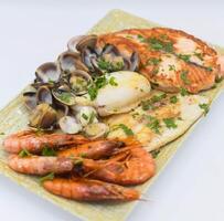 Grilled seafood in a Mediterranean restaurant photo