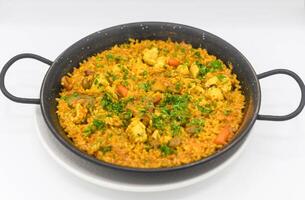 A typical Valencian seafood paella with rice photo