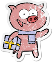 distressed sticker of a cheerful pig with christmas gift png