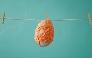 AI generated easter egg with paper on clothesline on blue background photo