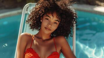 AI generated A young beautiful girl with thick dark curly hair in a red swimsuit lies and sunbathes on a white chaise lounge photo