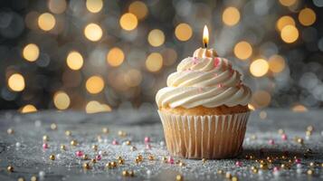 AI generated A birthday cupcake with a candle placed on a light grey table, set against a background of blurred lights photo