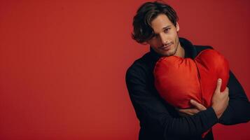 AI generated a handsome man hugging a large soft red heart, studio shot against a plain red background photo