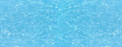 Blue water surface texture with ripples, splashes, and bubbles. Abstract summer banner background Water waves in sunlight with copy space cosmetic moisturizer micellar toner emulsion. Blue water wave. photo