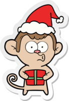 sticker cartoon of a christmas monkey wearing santa hat png