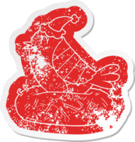 cartoon distressed sticker of a bird sitting on nest wearing santa hat png