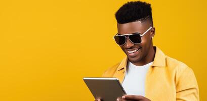 AI generated Stylish Man with Tablet on Yellow Background photo