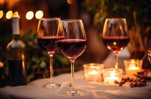 AI generated several glasses of red wine and candle lit on a holiday table photo