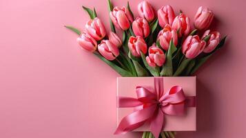 AI generated A stylish pink gift box with a ribbon bow and a bouquet of tulips photo