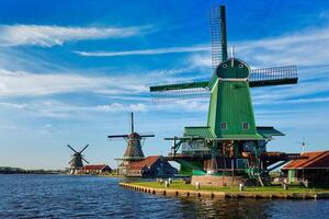 Windmills at Zaanse Schans in Holland on sunset. Zaandam, Nether photo