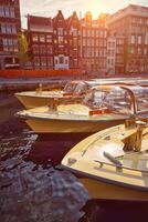 Amsterdam tourist boats in canal photo