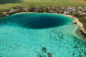 Top view of the Blue Bay lagoon of Mauritius. A boat floats on a turquoise lagoon photo