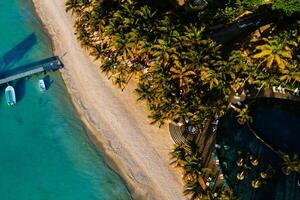 On the beautiful beach of the island of Mauritius along the coast. Shooting from a bird's eye view of the island of Mauritius. photo