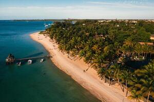 On the beautiful beach of the island of Mauritius along the coast. Shooting from a bird's eye view of the island of Mauritius. photo