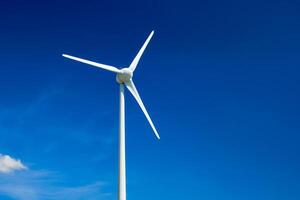 Wind generator turbines in sky photo