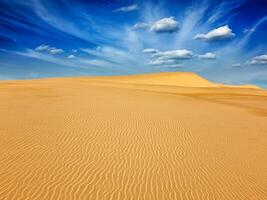 Desert sand dunes on sunrise photo