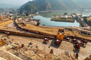 Tourists riding elephants on ascend to Amer fort photo