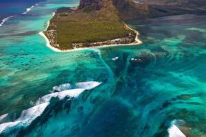 View from the height of the island of Mauritius in the Indian Ocean and the beach of Le Morne-Brabant photo