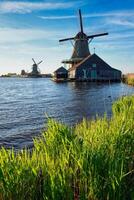 Windmills at Zaanse Schans in Holland on sunset. Zaandam, Nether photo