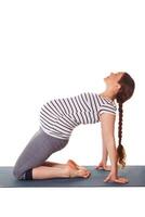 Pregnant woman doing yoga asana Ustrasana photo