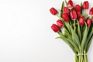 ai generado ramo de flores de hermosa rojo tulipanes en un blanco antecedentes con espacio para texto. de la madre día, marzo 8, cumpleaños. generado por artificial inteligencia foto