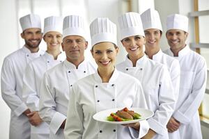 ai generado equipo de cocinero cocina presentación platos foto